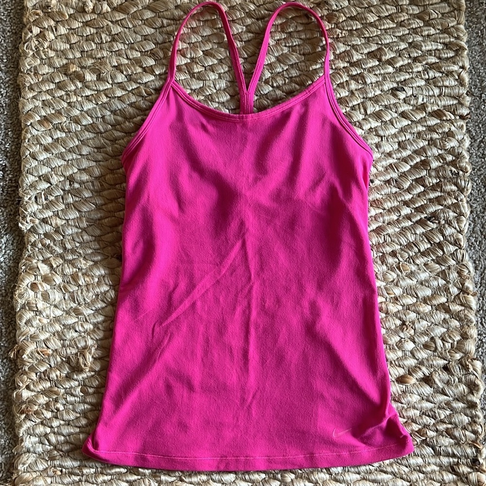 Nike “Dri- Fit” racer back tank top with built in bra. Size small.